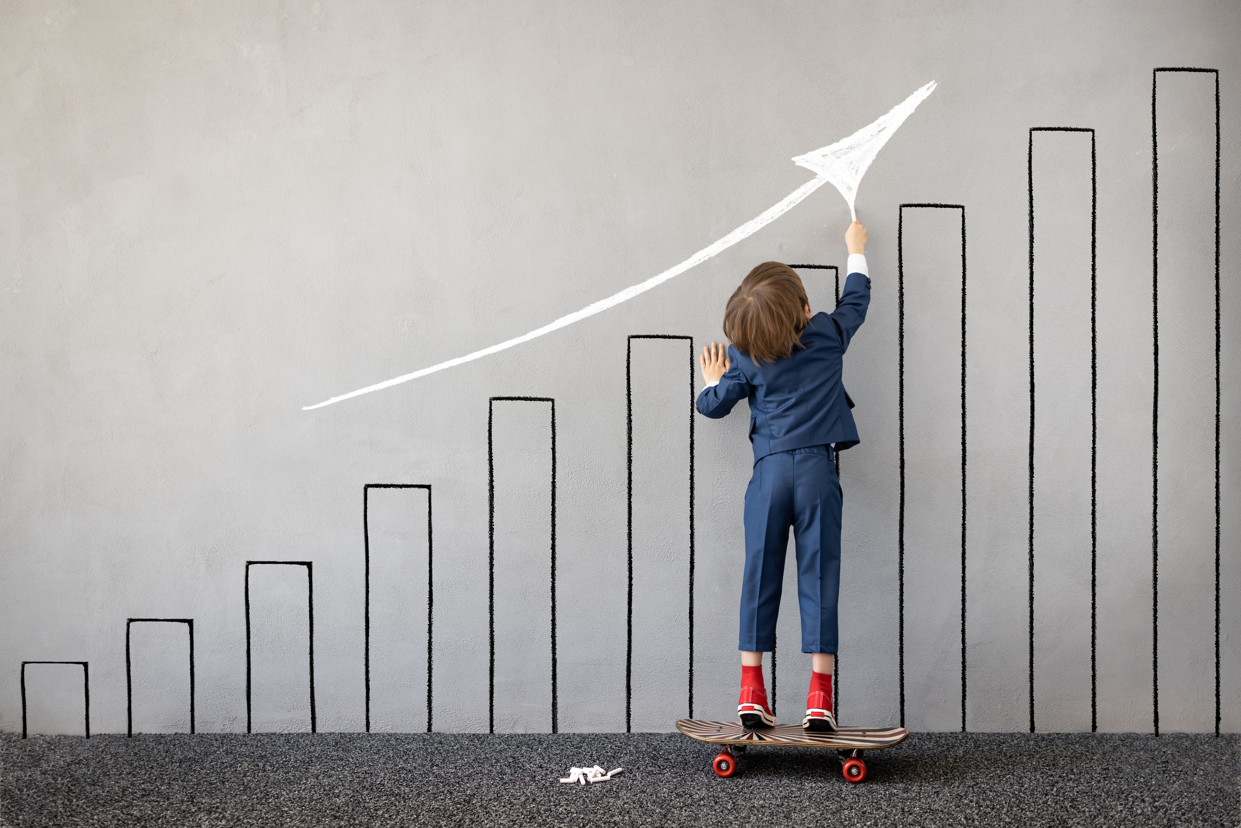 Child Draws a Chalk Graph on the Wall