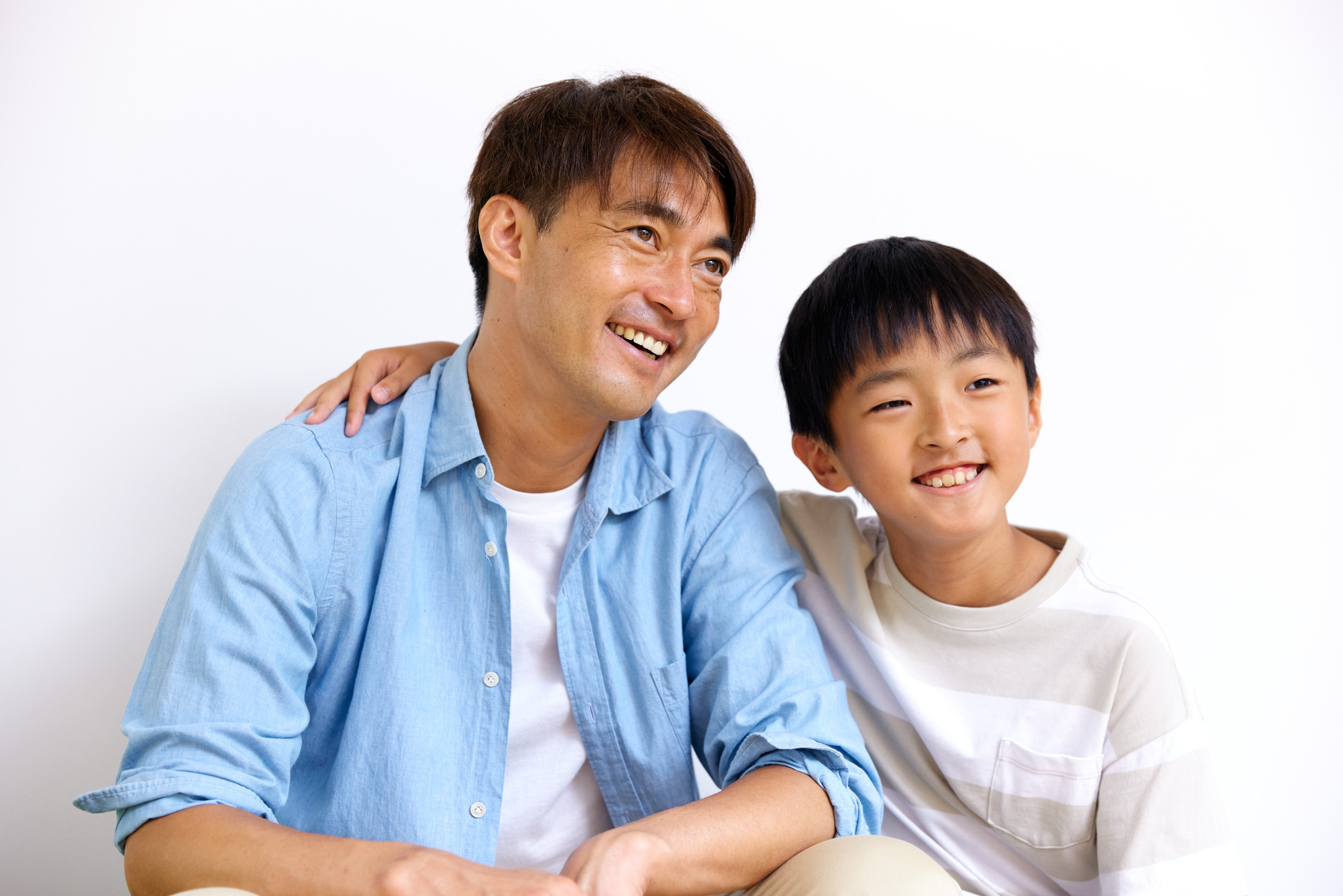 Father and Son Smiling Together